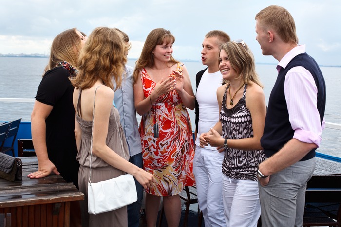 Company,Of,Seven,Young,Caucasian,People,Standing,On,Cruise,Ship